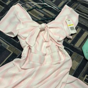 A white an pink onesie outfit very dressy.